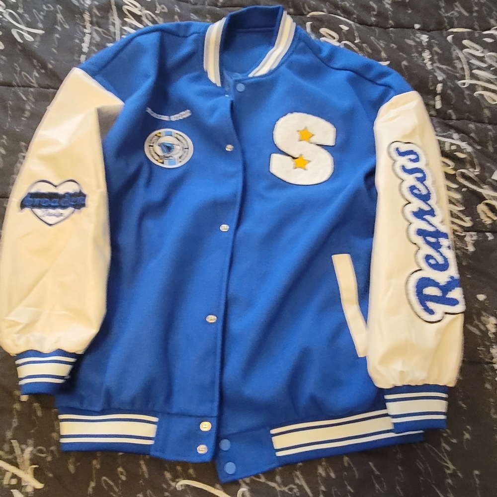 varsity Jacket size 4x runs a little small. Brand New